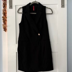 SPANX Black Garment with Red Brand Tag